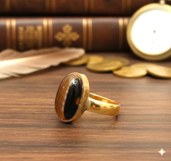 Gold ring with black stone detail